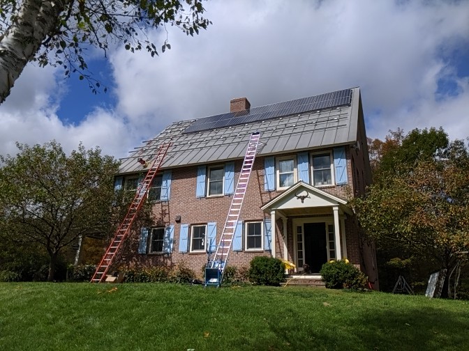 Solar panels being installed on a residential roof