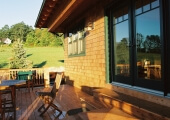 Deck of a home with a glass sliding door