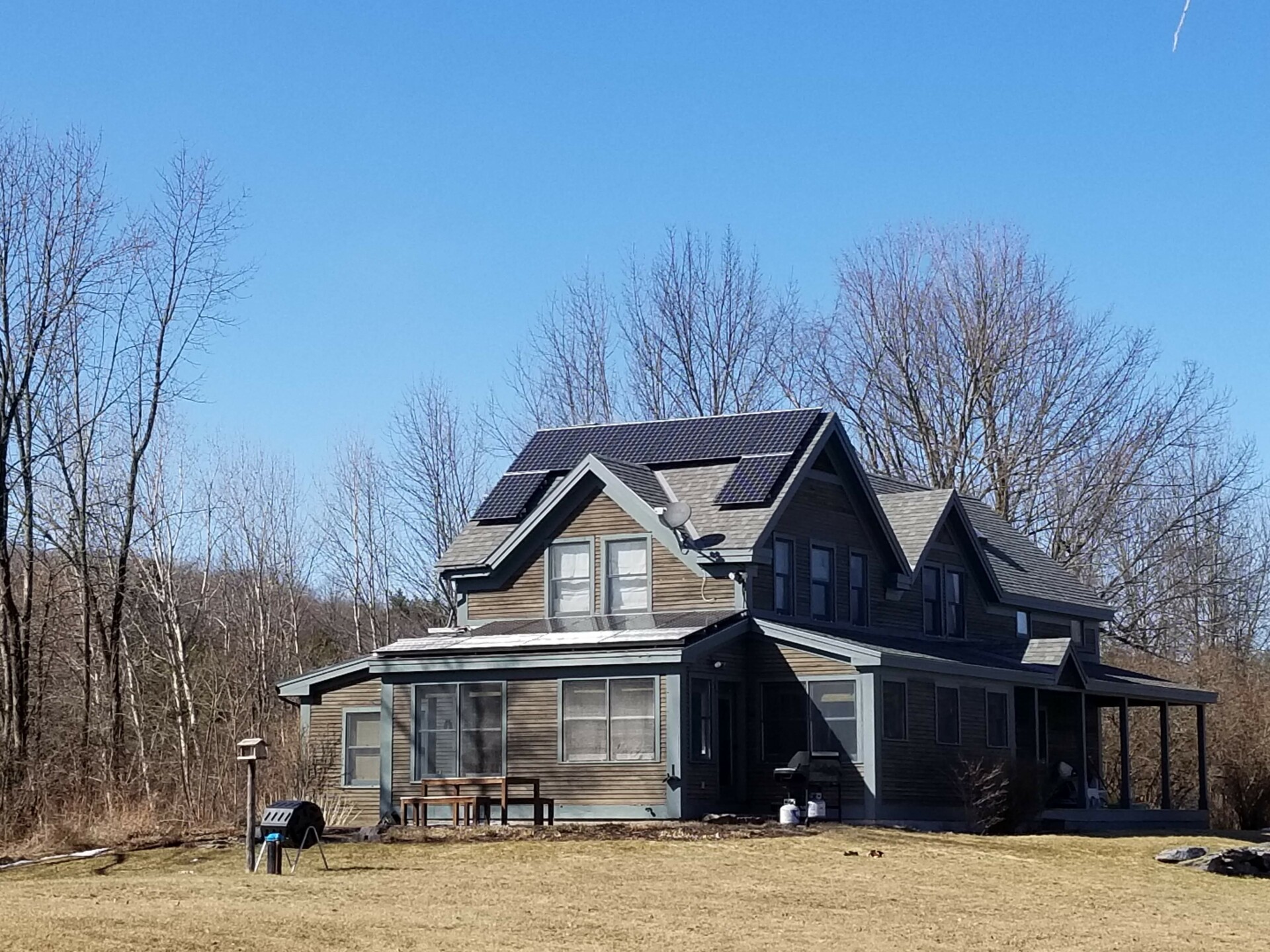 Large PV Solar Panels line the roof of a home that was recently the location of a efficiency project in Cornwall, VT.